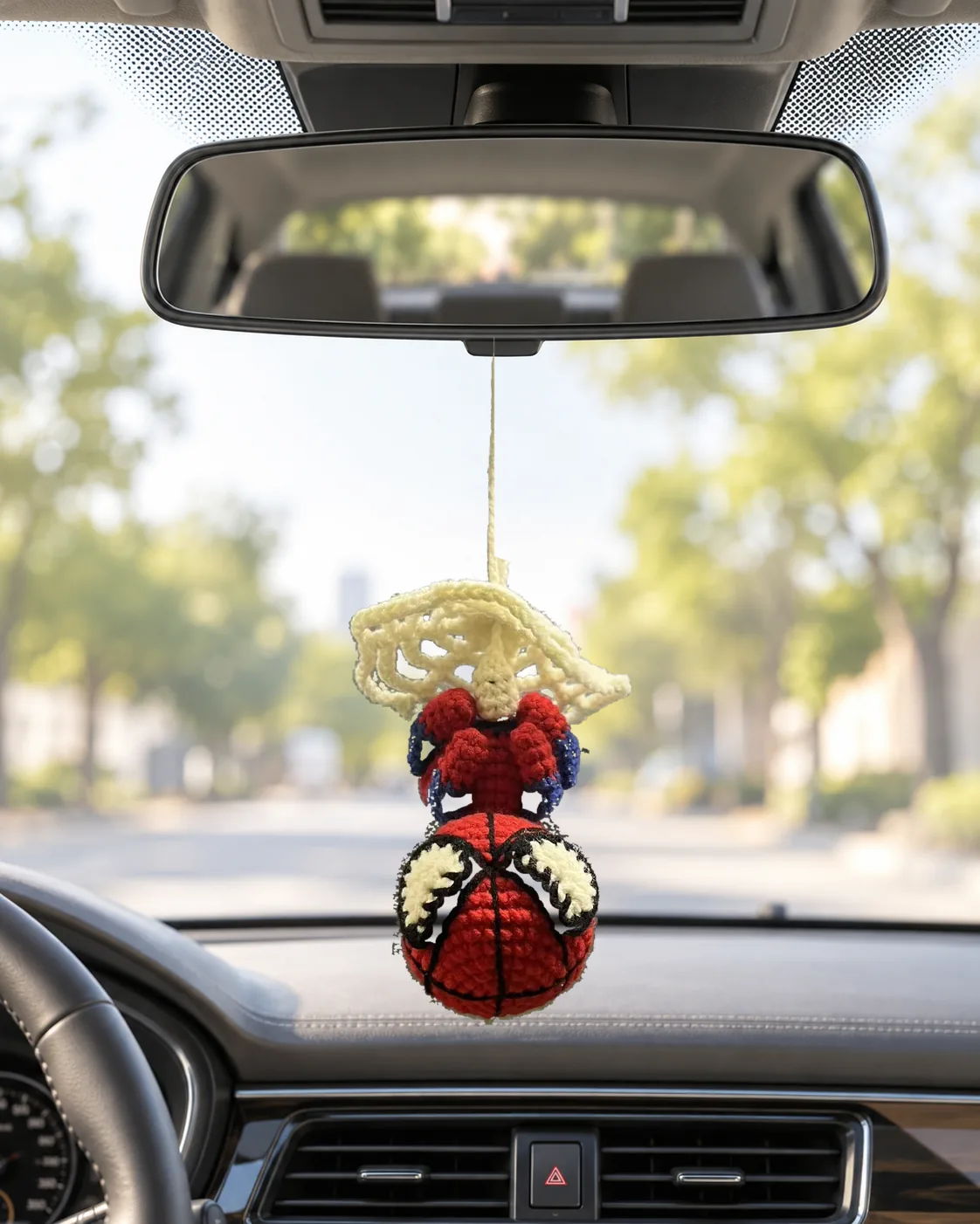 Crochet basketball hero charms hanging from a car mirror